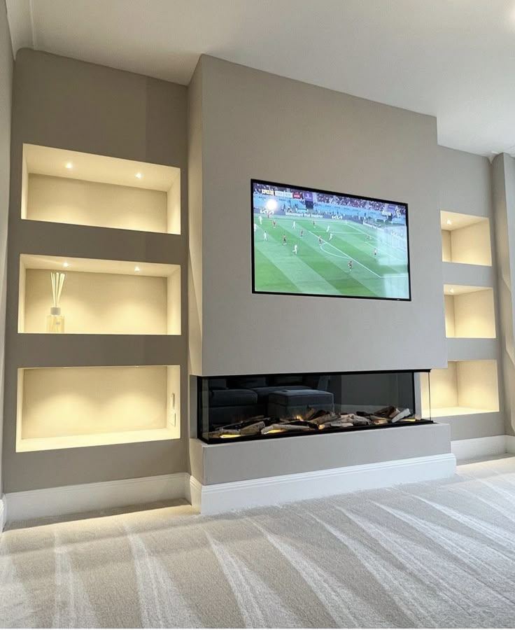 Electric Fire Build — Inset Fire and Shelving, an example of our bespoke media wall work