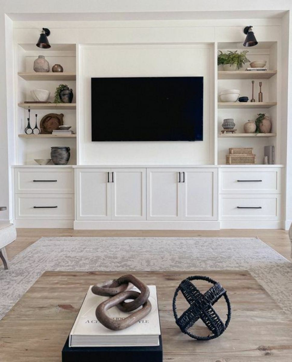 Bespoke media wall installation with illuminated shelving and concealed cabling